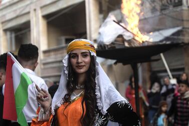 Kurds dressed in traditional outfits celebrate Nowruz (Noruz) in the Kurdish-controlled city of Qamishly in northeastern Syria on March 20, 2019. Nowruz, alculated according to a solar calendar, marks the first day of spring and the beginning of the year in the Persian calendar. / AFP / Delil SOULEIMAN