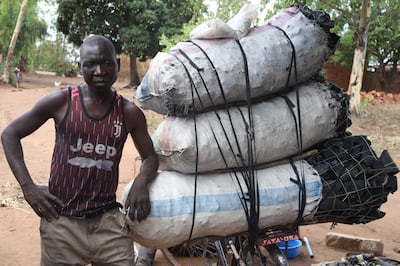 A man transporting charcoal to market in Phalombe, Malawi. Farai Shawn Matiashe/ The National
