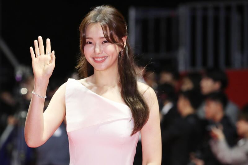 South Korean actress Lee Honey poses for a photograph as she arrives for the opening ceremony of the 24th Busan International Film Festival.  EPA