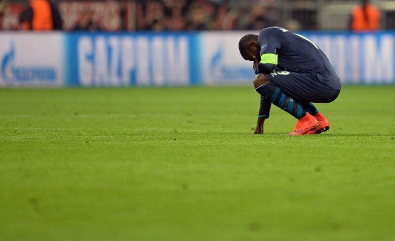 FC Porto's Jackson Martinez kneels dejected on the pitch after losing to Bayern Munich in the Champions League quarter-final second leg on Tuesday. Andreas Gebert / EPA