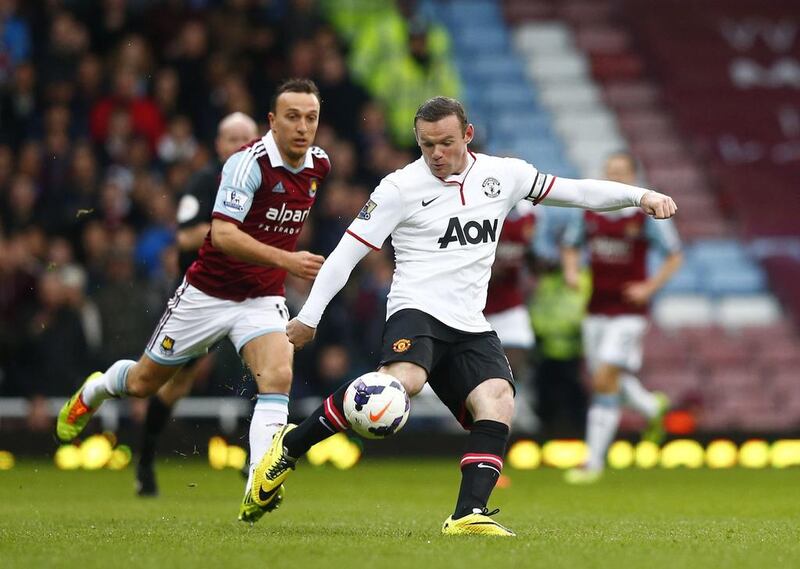 Manchester United's Wayne Rooney lines up his goal-scoring shot from distance on Saturday. Andrew Winning / Reuters / March 22, 2014