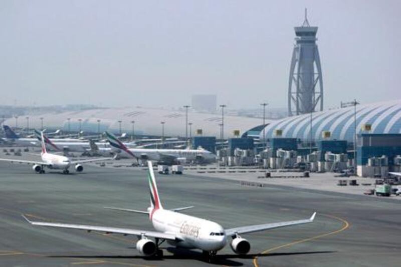 An Emirates airline passenger jet taxis on the tarmac at Dubai International airport in Dubai, United Arab Emirates, Tuesday April 20, 2010. Emirates airline's president says the European aviation industry could face an "implosion" if the volcanic ash cloud disrupts flights indefinitely. (AP Photo/Kamran Jebreili) *** Local Caption ***  ARE106_Emirates_Dubai_Iceland_Volcano.jpg