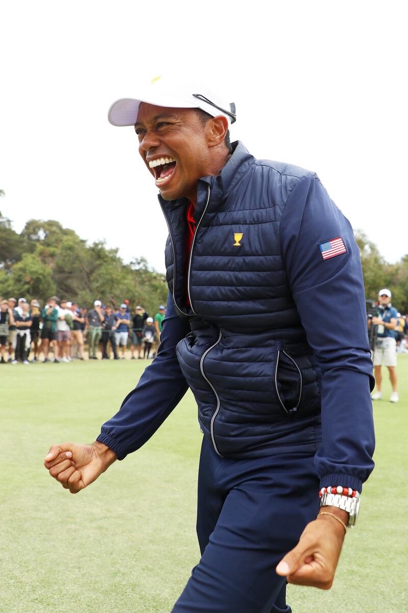 Woods celebrates after clinching the Presidents Cup. Getty