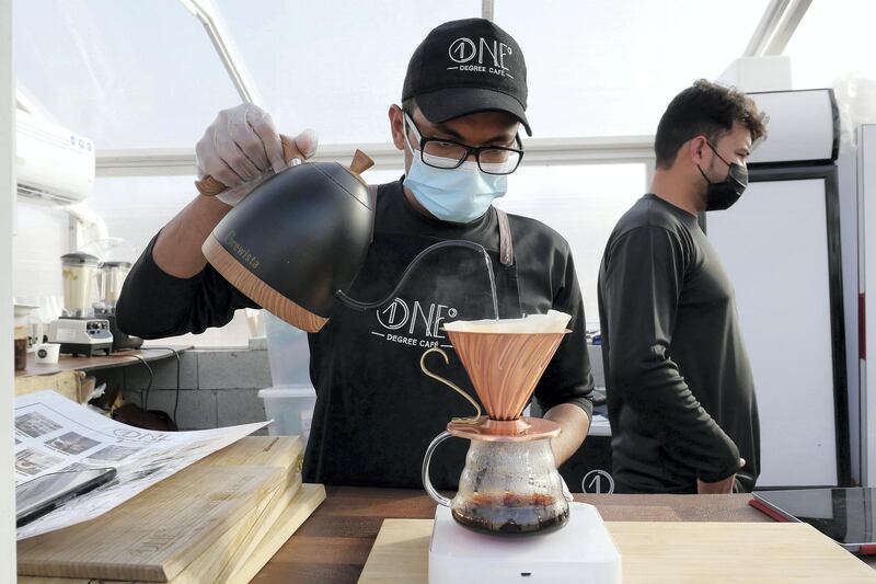 DUBAI, UNITED ARAB EMIRATES , March 1, 2021 – Staff preparing filter coffee at the One Degree Café in Margham area in Dubai. (Pawan Singh / The National) For Lifestyle/Instagram/Online. Story by Janice