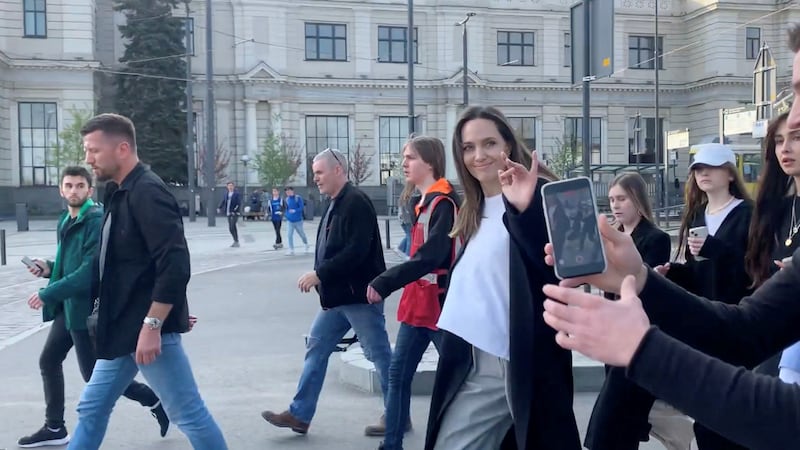 Jolie waves as she evacuates during her visit to Lviv, amid air raid sirens during the Russian invasion of Ukraine. Reuters