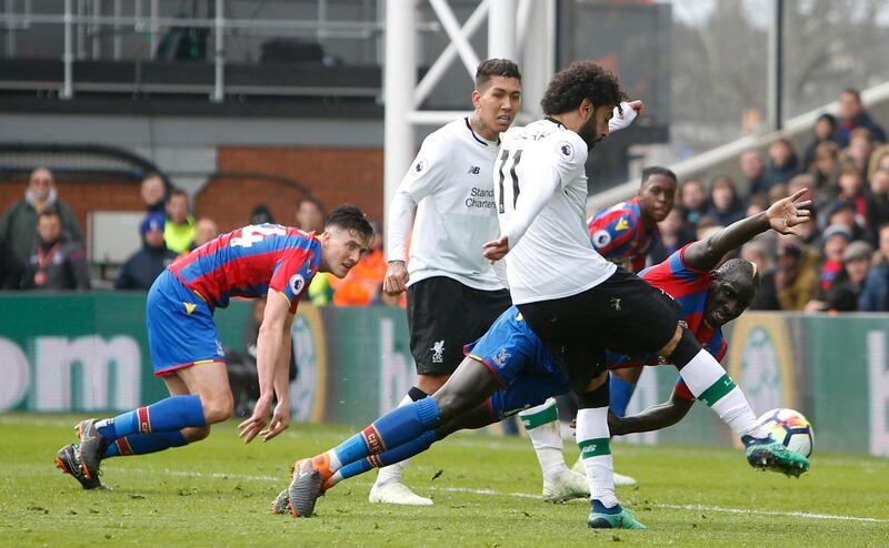 Liverpool's Mohamed Salah shoots and scores his side's second goal of the game during the English Premier League match between Crystal Palace and Liverpool at Selhurst Park on March 31, 2018. Liverpool won the match 2-1. Alastair Grant / AP Photo