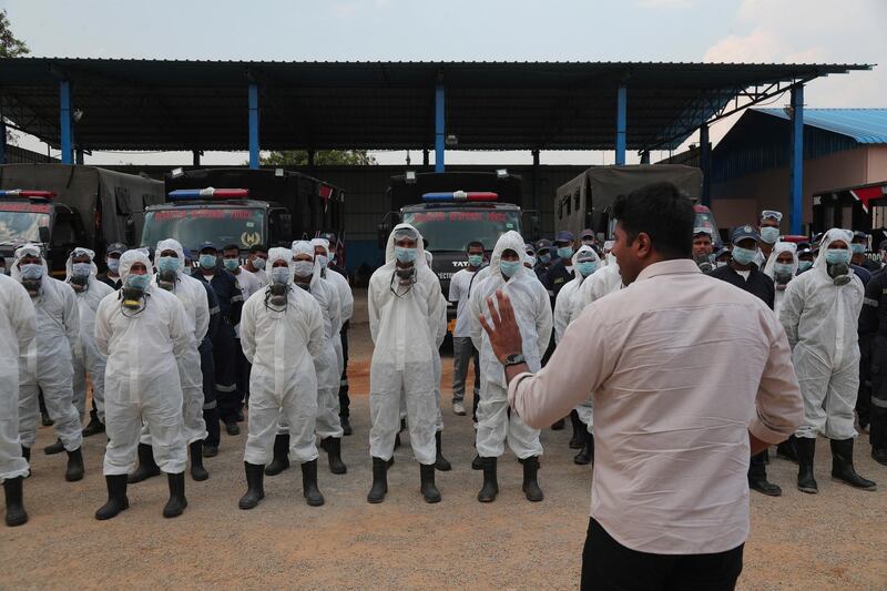 Director Disaster Response Force of Telangana State Vishwajeet Kampati gives instructions to members of his team prior to spraying disinfectants as a precautionary measure against Covid-19 in Hyderabad, India. AP Photo