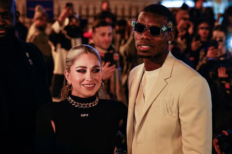 Manchester United and France player Paul Pogba with wife Maria Zulay Salaues at Paris Fashion Week. AFP