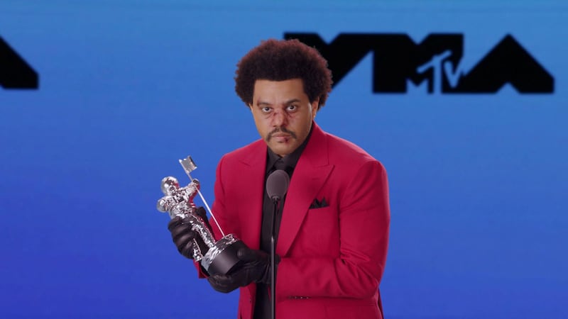 The Weeknd accepts the award for Best R&B during the 2020 MTV VMAs in this screen grab image made available on August 30, 2020. VIACOM/Handout via REUTERS ATTENTION EDITORS - THIS IMAGE HAS BEEN SUPPLIED BY A THIRD PARTY. EDITORIAL USE ONLY. NO RESALES. NO ARCHIVES.