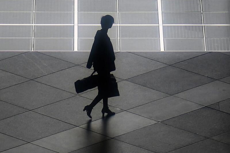 A woman walks in the shadows in Tokyo on May 12, 2017. Temperatures rose to 27C in the city, according to the Japan meteorological agency. Eugene Hoshiko / AP