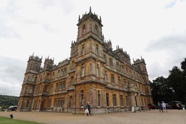 Visitors attend a 1920's themed event at Highclere Castle, near Newbury, west of London, on September 7, 2019, ahead of the world premiere of the Downton Abbey film. Highclere Castle is the main set location of the British television series Downton Abbey, which has been turned into a film, and will premiere on September 9 in London. / AFP / Isabel INFANTES