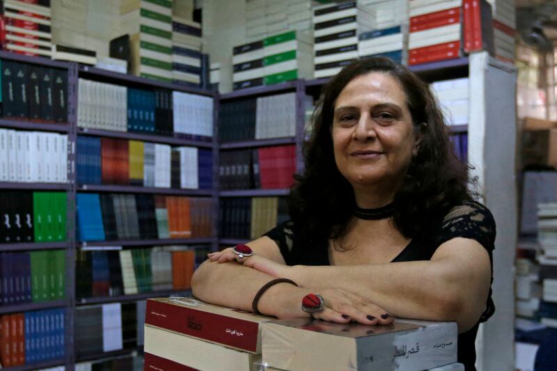 Samar Haddad poses for a picture at the Dar Atlas publishing house, founded by her father in 1955. Damascus bookshops and publishing houses are being replaced with shoe shops and financial services companies.