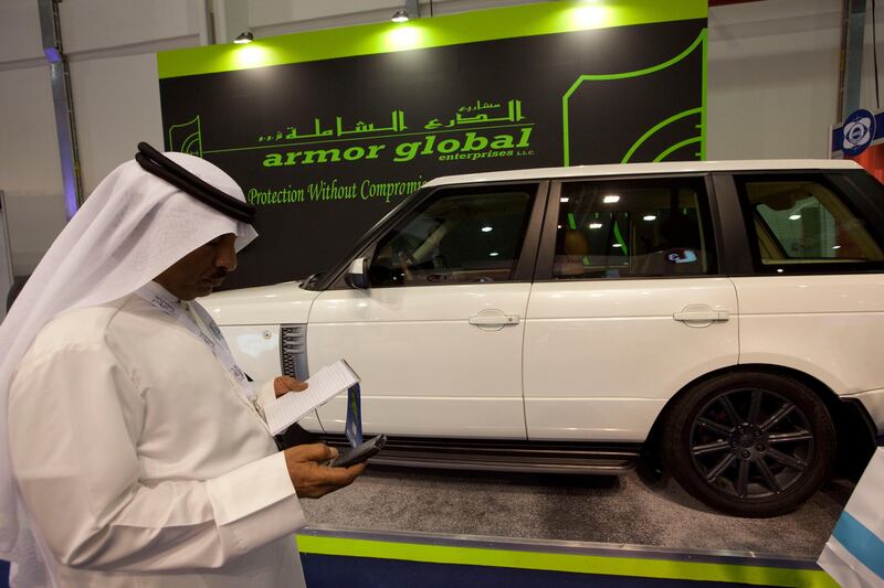 Dubai, United Arab Emirates, Feb 17, 2013 - A man look an armored rage rover at armor global showroom during IDEX, International Defense Exhibition Conference at Abu Dhabi Exhibition Centre, ADNEC.   ( Jaime Puebla / The National Newspaper ) To hold with john henzell story idex ancillary stalls *** Local Caption ***  JP0217-IDEX16.jpg