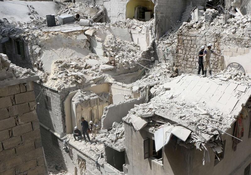 Destroyed buildings after they were targeted in a reported barrel bomb attack by Syrian government forces on the central Al Fardous rebel-held neighbourhood of the northern Syrian city of Aleppo on April 29, 2015. Zein Al Rifai/AFP Photo

