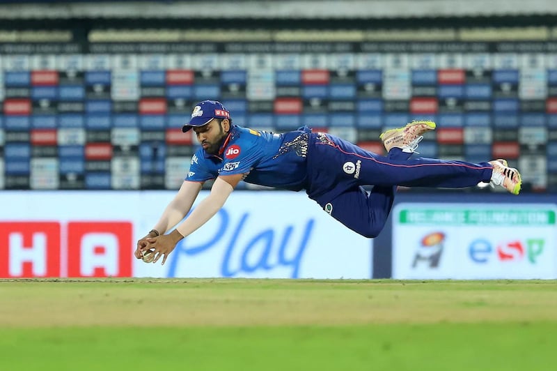 Rohit Sharma Captain of Mumbai Indians dives to field the ball during match 1 of the Vivo Indian Premier League 2021 between Mumbai Indians and the Royal Challengers Bangalore held at the M. A. Chidambaram Stadium, Chennai on the 9th April 2021. Photo by Faheem Hussain / Sportzpics for IPL