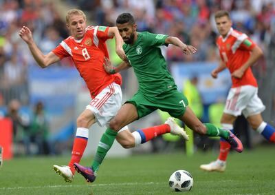 epa06807407 Yury Gazinsky (L) of Russia in action against Salman Al-Faraj of Saudi Arabia  during the FIFA World Cup 2018 group A preliminary round soccer match between Russia and Saudi Arabia in Moscow, Russia, 14 June 2018.

(RESTRICTIONS APPLY: Editorial Use Only, not used in association with any commercial entity - Images must not be used in any form of alert service or push service of any kind including via mobile alert services, downloads to mobile devices or MMS messaging - Images must appear as still images and must not emulate match action video footage - No alteration is made to, and no text or image is superimposed over, any published image which: (a) intentionally obscures or removes a sponsor identification image; or (b) adds or overlays the commercial identification of any third party which is not officially associated with the FIFA World Cup)  EPA/PETER POWELL   EDITORIAL USE ONLY