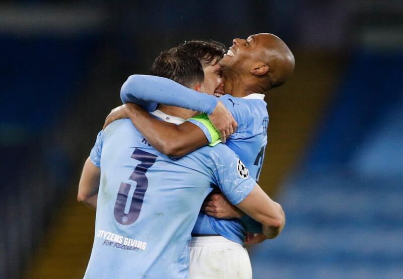 Soccer Football - Champions League - Semi Final Second Leg - Manchester City v Paris St Germain - Etihad Stadium, Manchester, Britain - May 4, 2021 Manchester City's Fernandinho, Ruben Dias and John Stones celebrate after the match REUTERS/Phil Noble