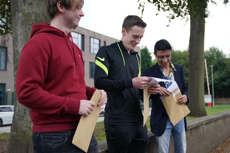 Students at Plantsbrook School in Sutton Coldfield, central England, open their A-level results. PA