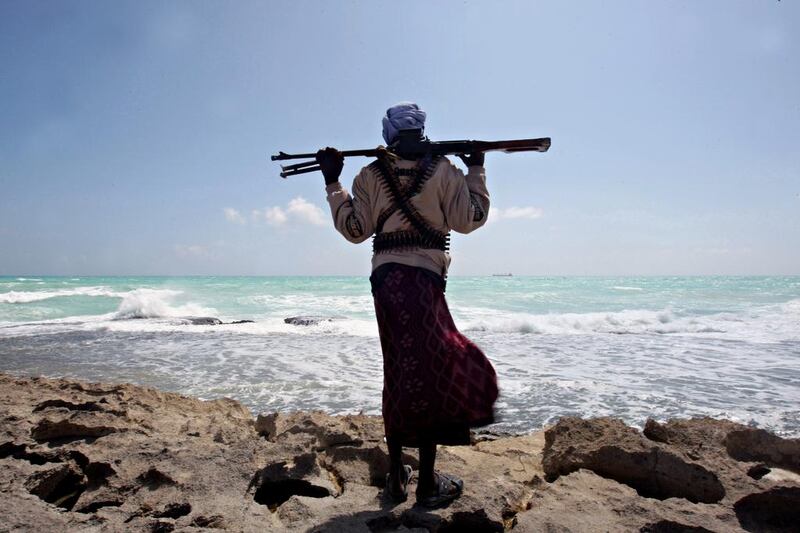 A pirate stands on the shore in north-east Somalia. AFP