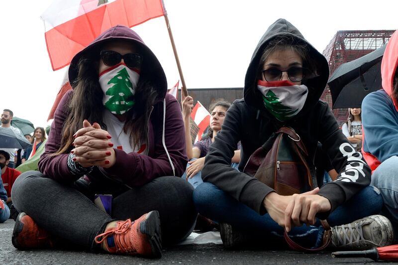 Protesters listen to a speech by President Michel Aoun in Jal El Dib, north of Beirut. EPA