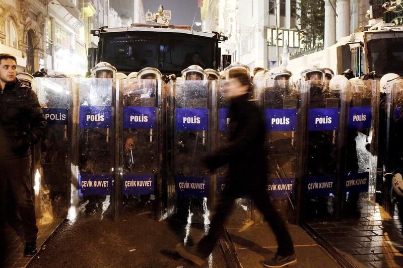 Turkish riot police block Istanbul's central shopping street, Istiklal, during a demonstration on December 23. The Turkish government dismissed 350 police officers in Ankara, the capitol, on Tuesday following an anti-corruption probe which the prime minister, Recep Tayyip Erdogan, claims is targeting his government. Sedat Suna/EPA