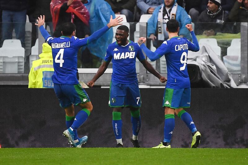 Sassuolo's Ivorian forward Jeremie Boga (C) celebrates with teammates after scoring. AFP