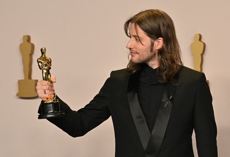 Swedish composer Ludwig Goransson with the Oscar for Best Original Score for Oppenheimer during the 96th Annual Academy Awardsa. AFP