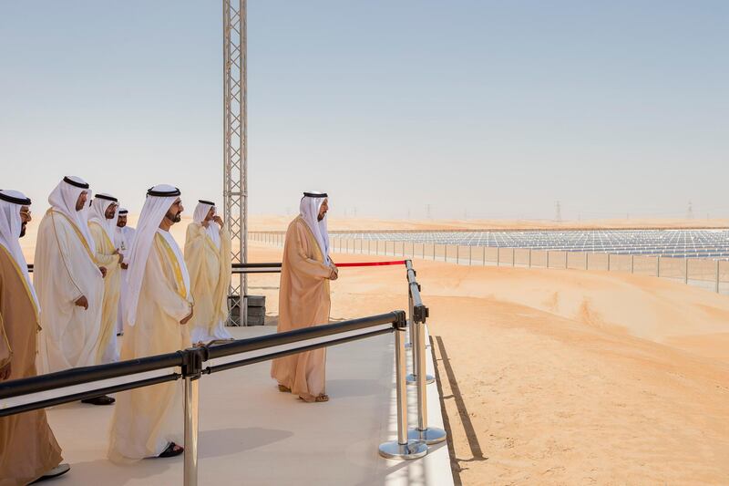 MADINAT ZAYED, WESTERN REGION OF ABU DHABI, UNITED ARAB EMIRATES - March 17, 2013: HH Sheikh Khalifa bin Zayed Al Nahyan President of the UAE and Ruler of Abu Dhabi (R), looks at the Shams 1 Concentrated Solar Power plant during the opening ceremony. Shams 1 is a project of the Shams Power Company, a subsidiary of Masdar, in association with Total and Abengoa Solar. Seen with HH Sheikh Tahnoon bin Mohammed Al Nahyan Ruler's Representative of the Eastern Region (L), HE Dr Sultan Ahmed Al Jaber CEO of Masdar (2nd L), HH General Sheikh Mohamed bin Zayed Al Nahyan Crown Prince of Abu Dhabi Deputy Supreme Commander of the UAE Armed Forces (3rd L), HH Sheikh Mohammed bin Rashid Al Maktoum Vice-President Prime Minister of the UAE and Ruler of Dubai (4th L) and others..( Ryan Carter / Crown Prince Court - Abu Dhabi ).---
