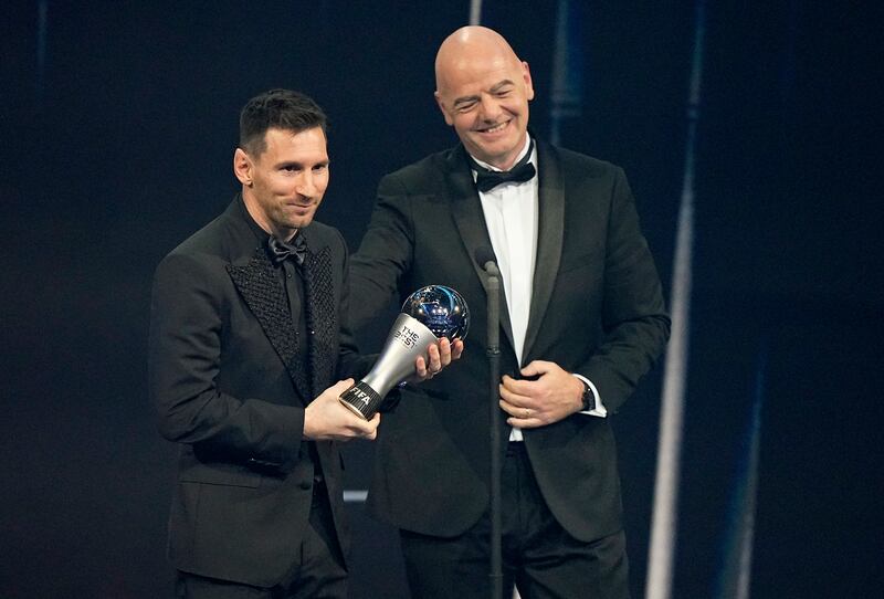 Argentina's Lionel Messi receives the Best Fifa Men's player award from Fifa president Gianni Infantino. AP