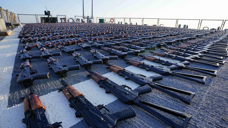 Thousands of AK-47 assault rifles on the flight deck of a US Navy vessel that were seized from a fishing boat in the Gulf of Oman. Picture: US Navy