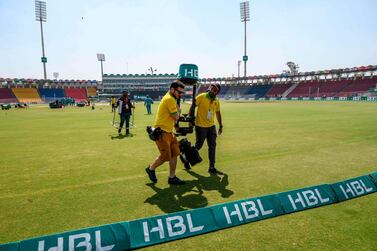 Crew members of Tower Sports pack up their equipment at the Gaddafi Cricket Stadium in Lahore on March 17, 2020. Pakistan's Twenty20 cricket league was suspended on March 17 just hours before the start of the semi-finals because of the coronavirus pandemic. / AFP / ARIF ALI