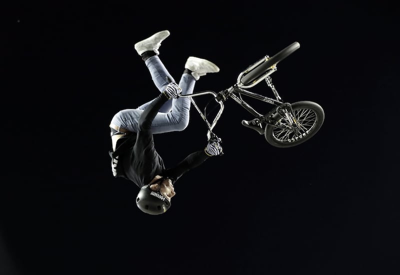 A cyclist performs stunts in an extreme sports exhibition during the Xknights event, in San Jose, Costa Rica. EPA