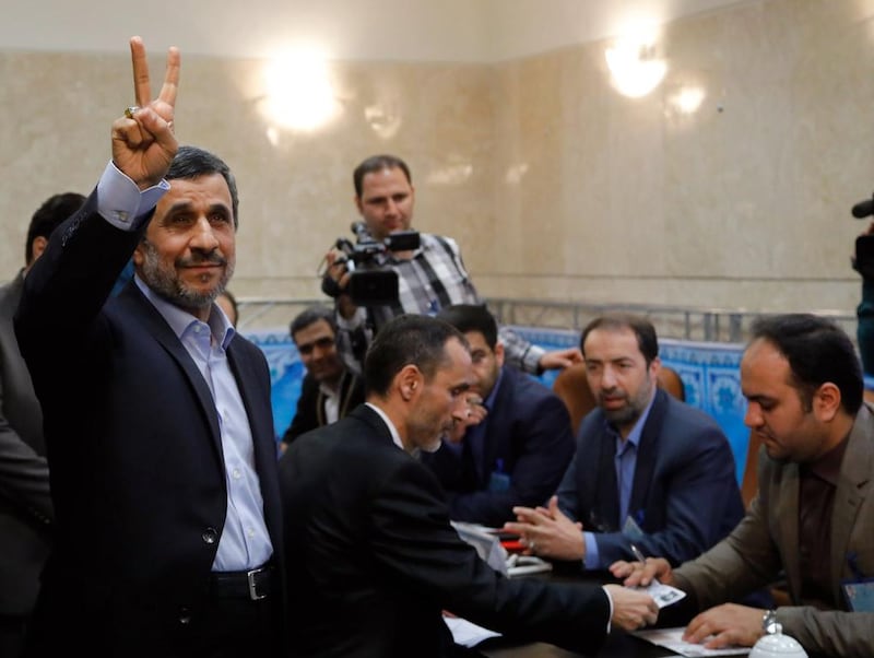 Former Iranian president Mahmoud Ahmadinejad, left, flashing the victory sign on April 12, 2017 during the surprise registration of his candidacy. Abdein Taherkenareh/EPA