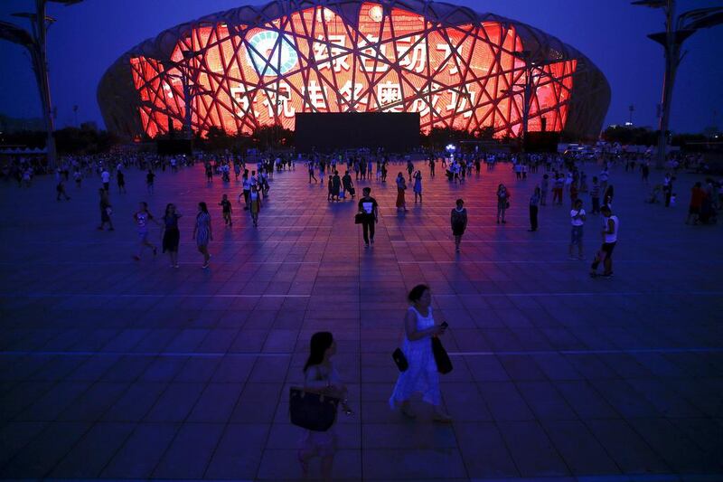 A message of congratulation is projected onto the Bird’s Nest Olympic Stadium as people gather after Beijing was chosen to host the 2022 Winter Olympics. Damir Sagolj / Reuters
