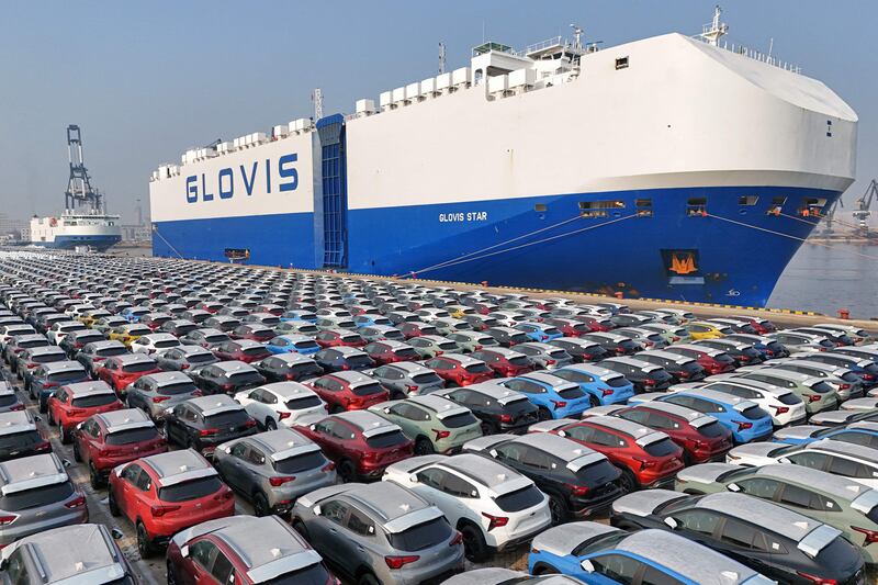 Cars wait to be loaded onto a ship for export at Yantai, in China's eastern Shandong province. AFP
