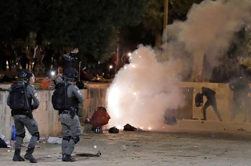 Tear gas billows amid clashes between Israeli security forces and Palestinian protesters near Al Aqsa Mosque in Jerusalem, on May 7, 2021. AFP