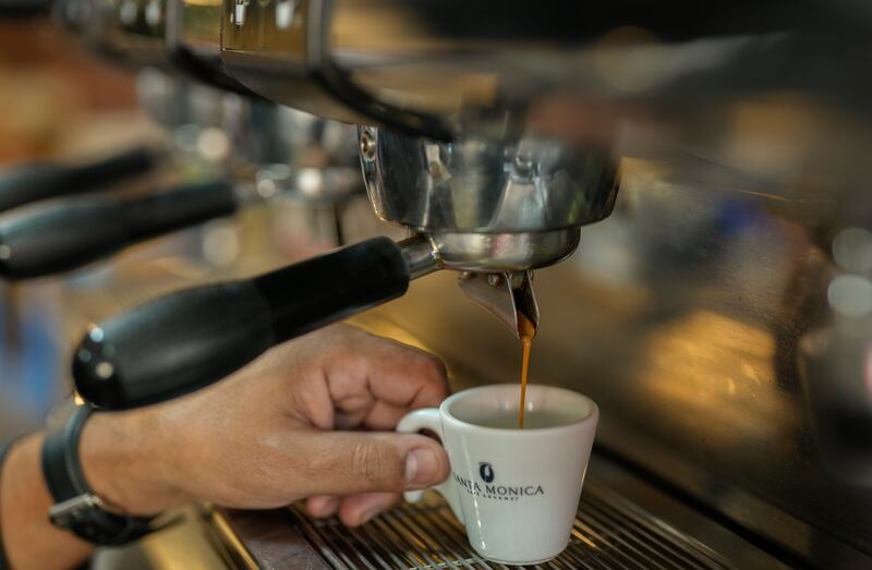 An espresso cup is prepared at a restaurant in Sao Paulo, Brazil. Coffee is among the products that rose in price recently, eroding the buying power of consumers. AP