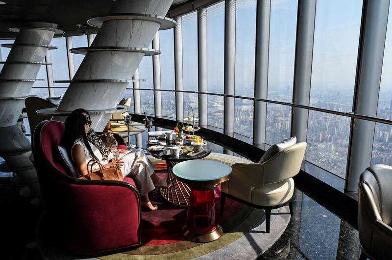Guests are seen at the J Hotel, the world's highest luxury hotel.