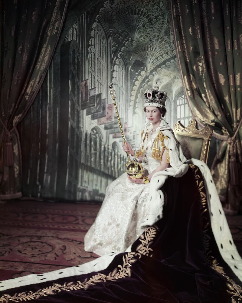 Queen Elizabeth II on her coronation day in 1953, holding the orb and sceptre