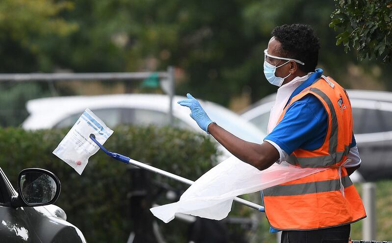 An NHS staff receives a self-administered Covid-19 test at a testing site in London, Britain. The UK government's Covid-19 testing program is coming under increasing pressure, with many people not able to get tests or are having to travel many miles to other towns and cities to receive one.  EPA