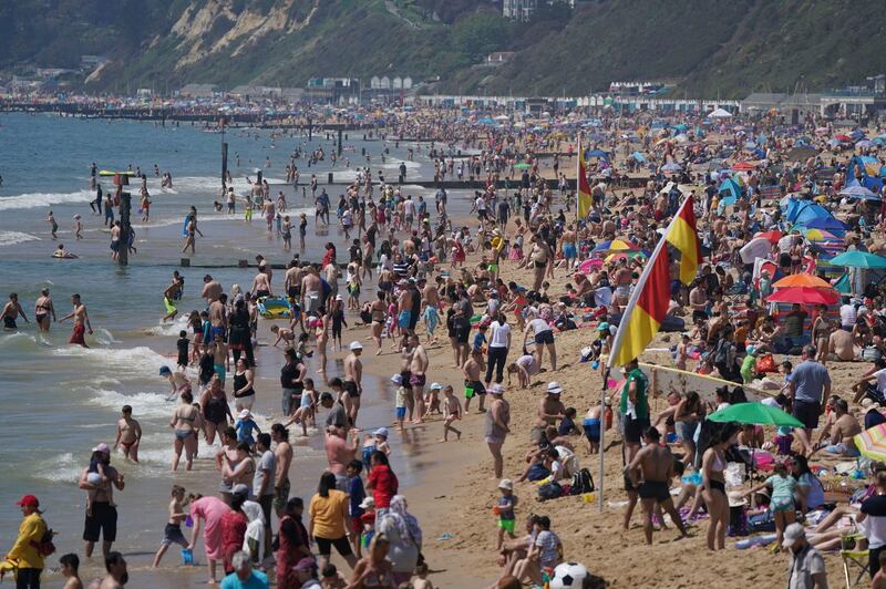 People gather on the beach in large numbers in Bournemouth. AP Photo