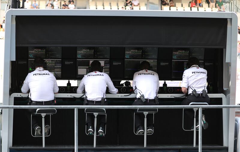 Mercedes team members on the pit wall during practice. Reuters