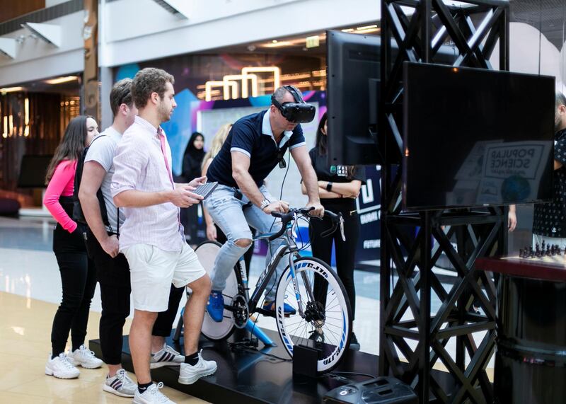 DUBAI, UNITED ARAB EMIRATES. 3 NOVEMBER 2019. 
VR excercise bike.
Dubai Future Foundation (DFF) launched Dubai Future Week which offers a schedule of community events and interactive workshops at AREA 2071 in Emirates Tower, as part of efforts to offer a global futuristic experience that promotes technological knowledge and applications.

Under the theme: “Imagining, Designing and Executing the Future”, participants will have the opportunity to preview international films that envision the future, play Human Experience 2.0, an awareness game that introduces futuristic technologies, marvel at the Future Exhibition of images, shopping and the future of food, and engage in Future Dialogues which will explore various sectors such as education, workforce, economics and transportation.

(Photo: Reem Mohammed/The National)

Reporter:
Section: