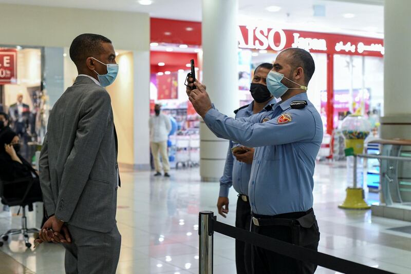 Face Scanning Detection-AD  Two securities have to stand within 5 meters of each other for the EDE scanner and face detection device to sync at Al Wahda Mall in Abu Dhabi on June 28, 2021. Khushnum Bhandari/ The National
Reporter: N/A News
