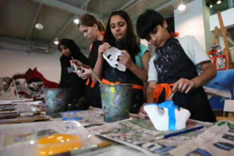 Students work on plaster masks during workshop at Jamjar studio in Al Barsha, Dubai.