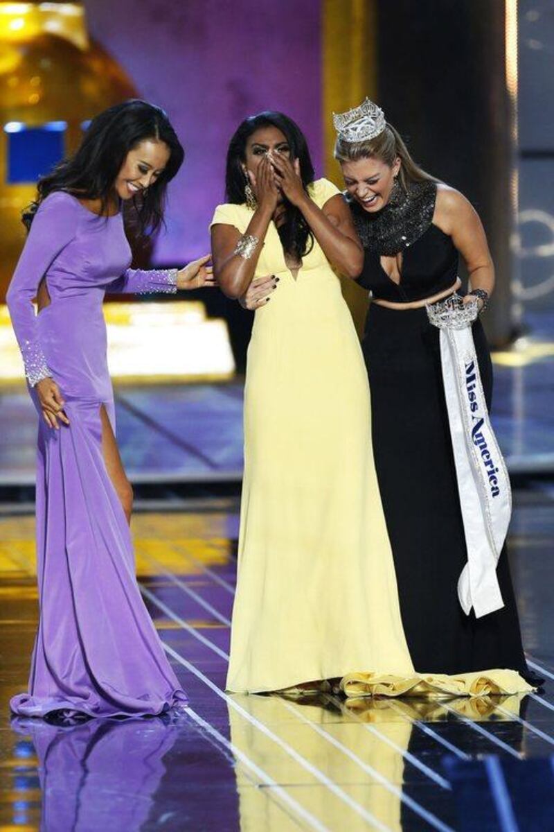 Miss America contestant, Miss New York Nina Davuluri (C) reacts with runner-up Miss California Crystal Lee (L) and 2013 Miss America Mallory Hagan after being chosen winner of the 2014 Miss America Pageant. Reuters/Lucas Jackson 