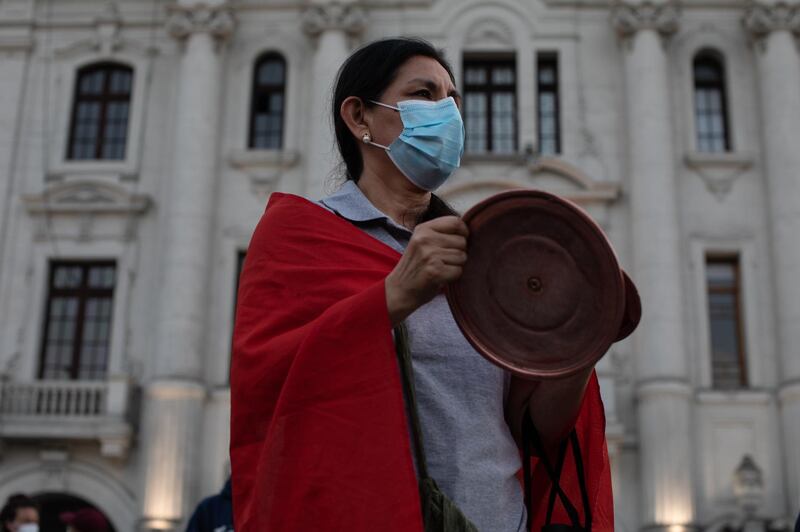 A demonstrator takes part in a protest at San Martin square in Lima. Bloomberg