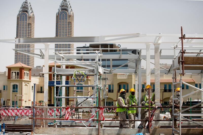 Dubai, April 23 2013 - Workers lay rail and build a station near Dubai Media City for the upcoming Al Safouh Tram Project in Dubai, April 23, 2013. (Photo by: Sarah Dea/The National)

