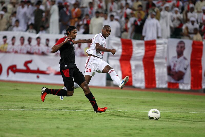 DUBAI , UNITED ARAB EMIRATES Ð Sep 14 :  Marcelo ( no 20 in white ) of Sharjah and Omar Ali ( no 8 ) of Emirates in action during the Pro League round robin tournament football match between Sharjah vs Emirates at Al Shabab stadium in Dubai. ( Pawan Singh / The National ) For Sports. Story by Ahmed