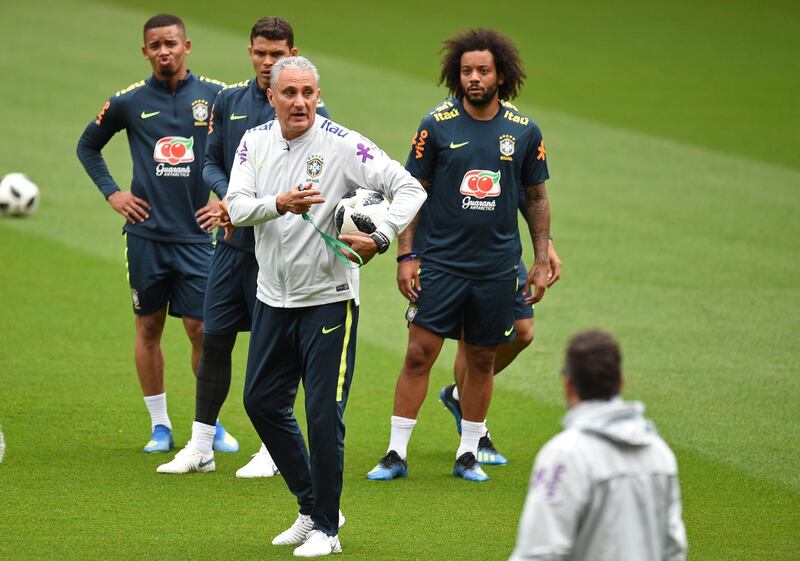 Brazil's head coach Tite (C) takes a team training session at Anfield stadium in Liverpool on June 2, 2018, ahead their International friendly football match against Croatia.  / AFP PHOTO / Oli SCARFF